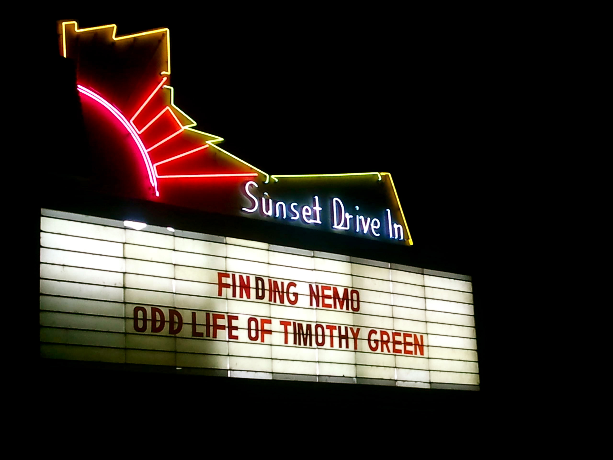 Image of neon Sunset Drive In sign.